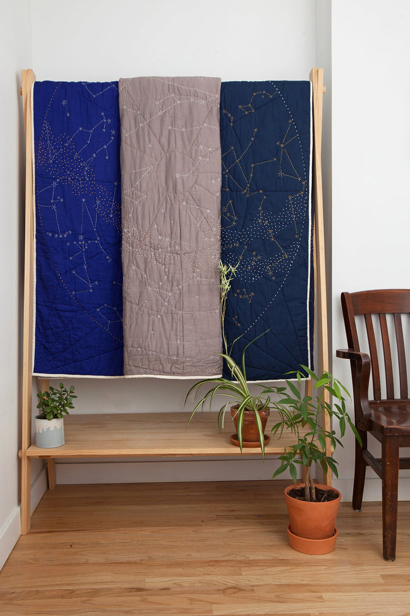 https://www.madetrade.com/cdn/shop/products/constellation-quilt-navy-quilts-haptic-lab-986951_800x.jpg?v=1652109030