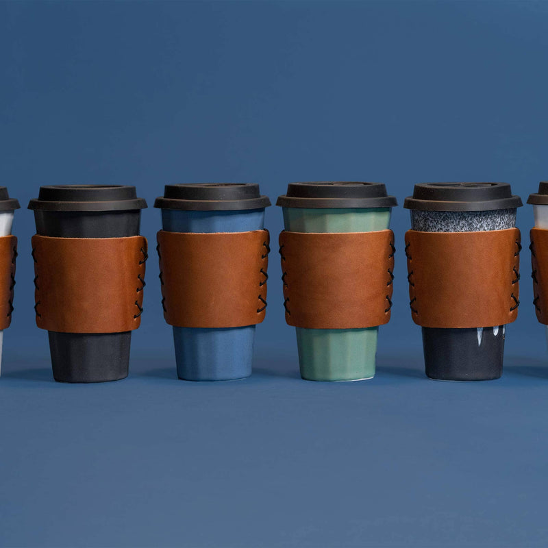 https://www.madetrade.com/cdn/shop/products/porcelain-travel-mug-drinkware-the-bright-angle-353531_800x.jpg?v=1674146954