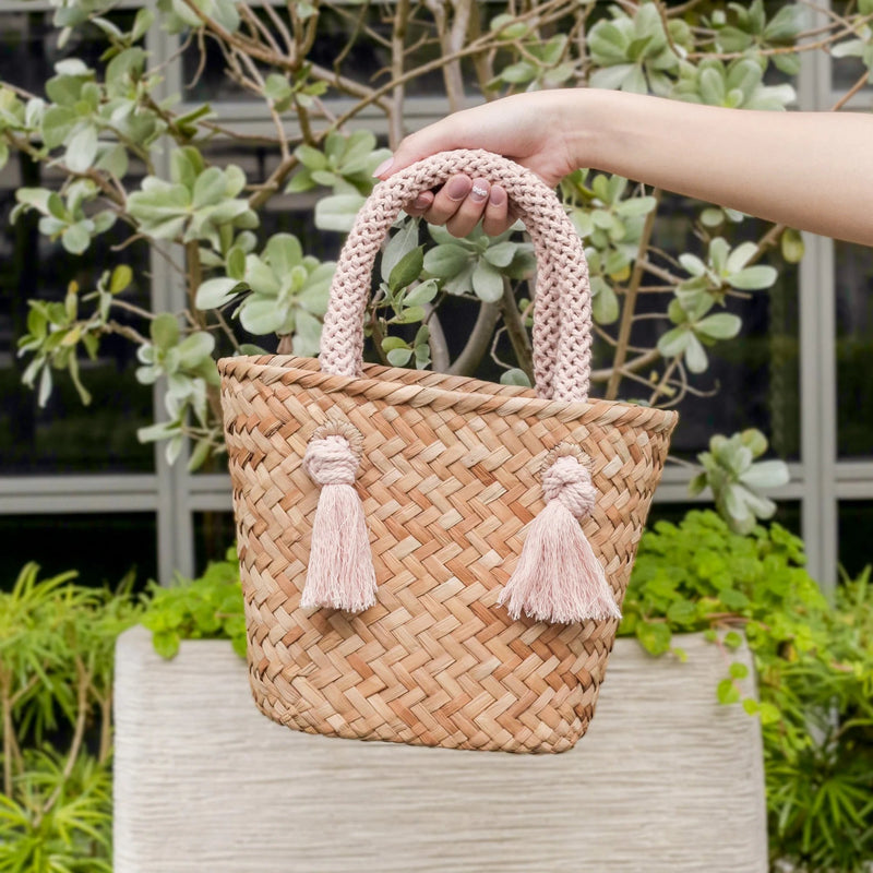 https://www.madetrade.com/cdn/shop/products/small-straw-tote-bag-with-braided-handles-handbags-likha-844233_800x.webp?v=1684859431